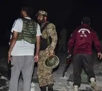 Army soldiers examine a building damaged by a suspected Indian missile attack near Muzaffarabad, the capital of Pakistan controlled Kashmir, Wednesday, May 7, 2025. (AP Photo/M.D. Mughal)